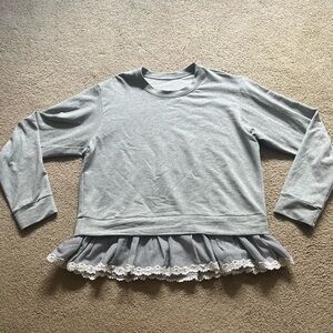 Francesca’s sweater with cool details.